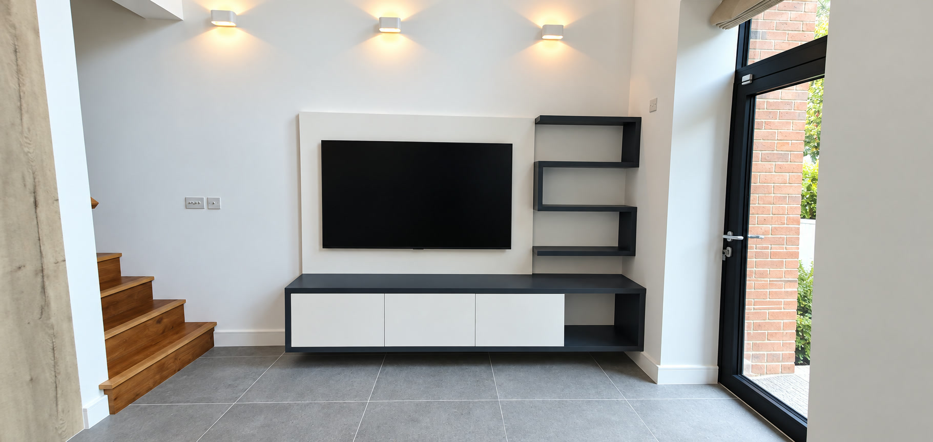 Wide view of the completed London living room with bespoke floating TV media furniture