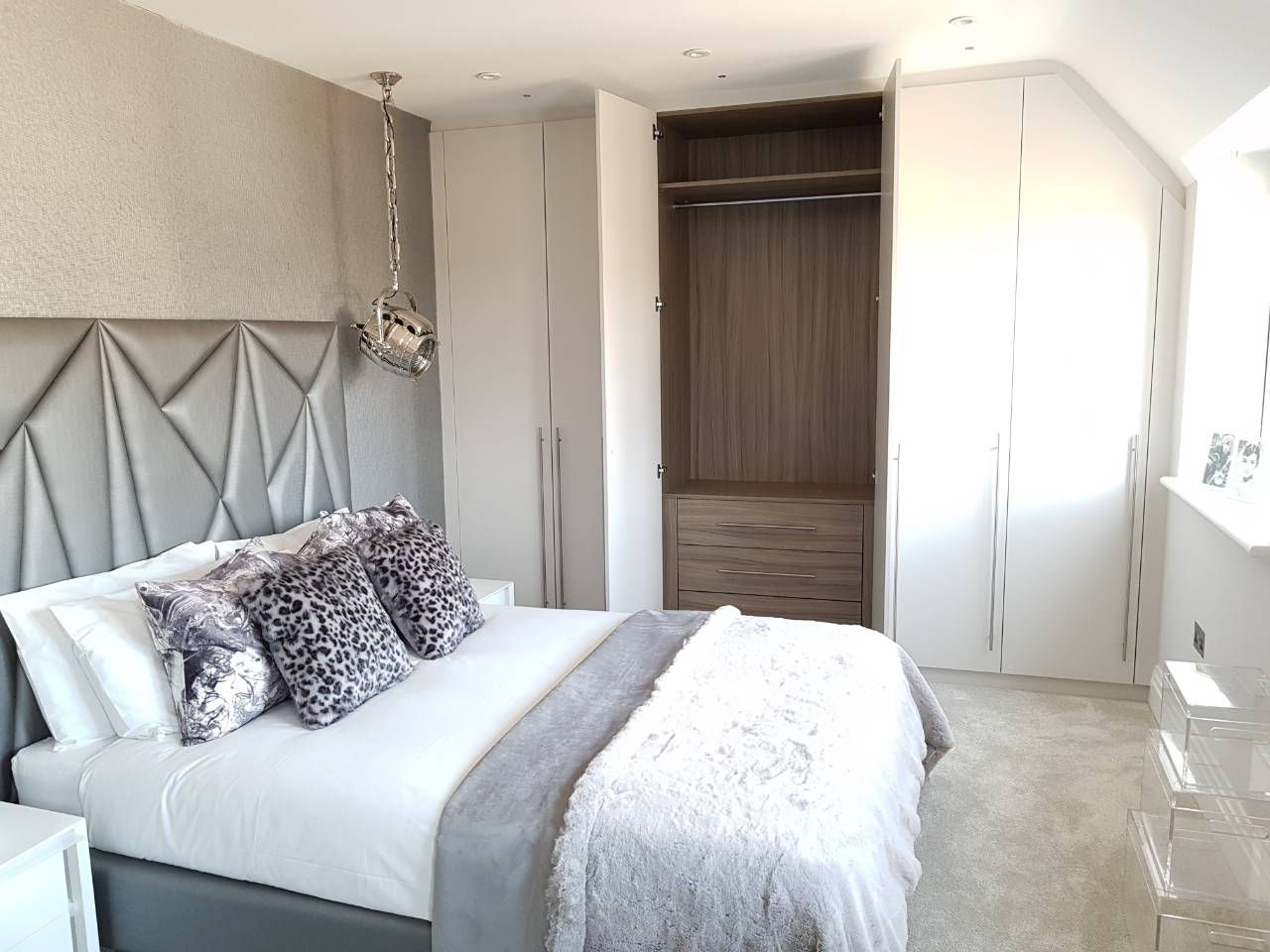 Open fitted wardrobe with drawers, shelves and hanging space